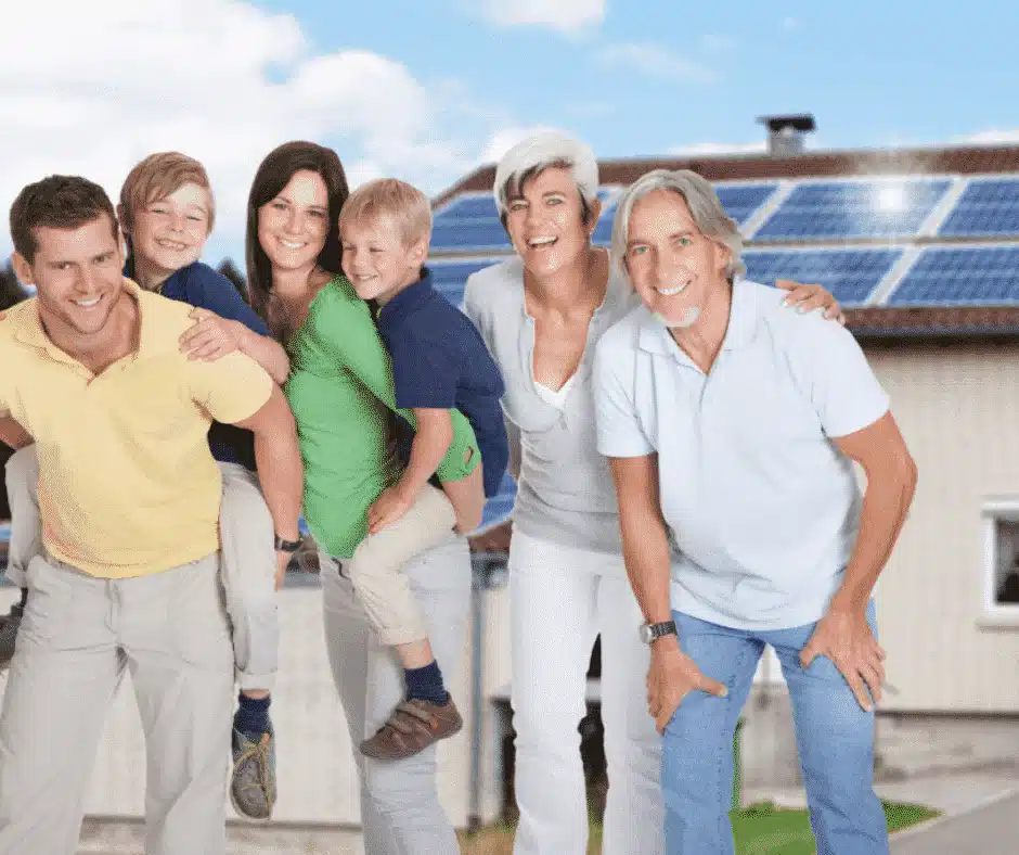 Family of six smiling with solar panels